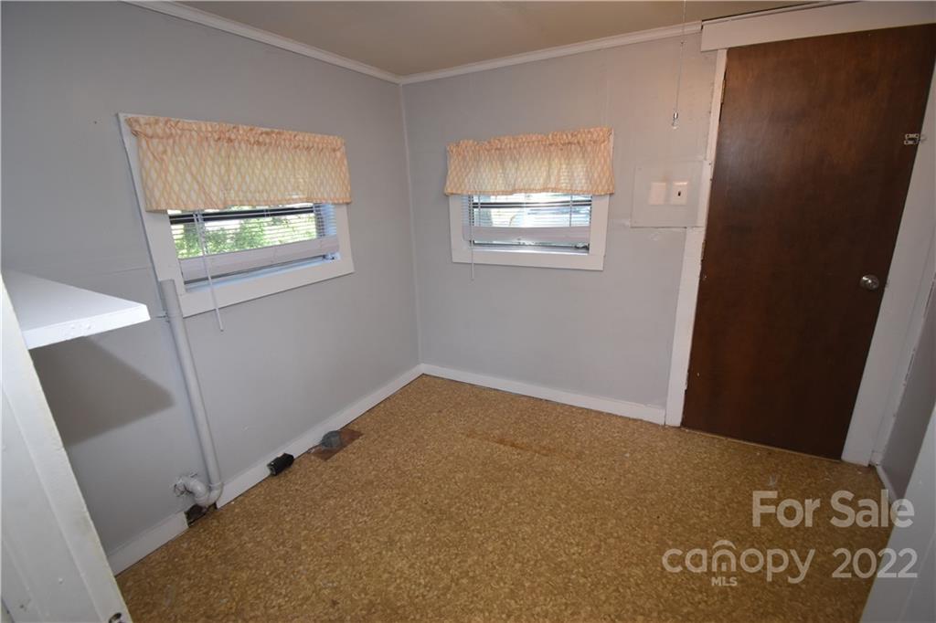 210 Proctor Street Lincolnton, NC 28092 - Photo 8 of 19 a view of an empty room with a window