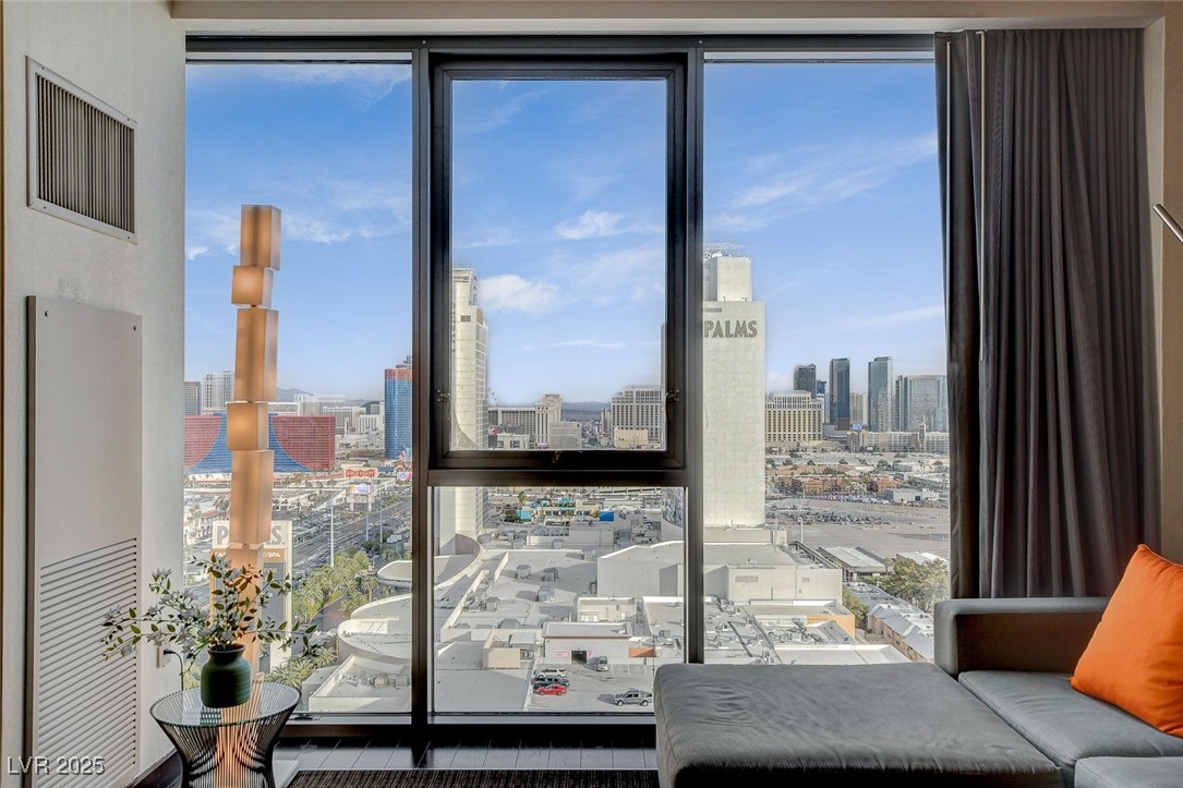 4381 West Flamingo Road, Unit 2204 Las Vegas, NV 89103 - Photo 22 of 27 Sitting room with a skyline view and plenty of natural light