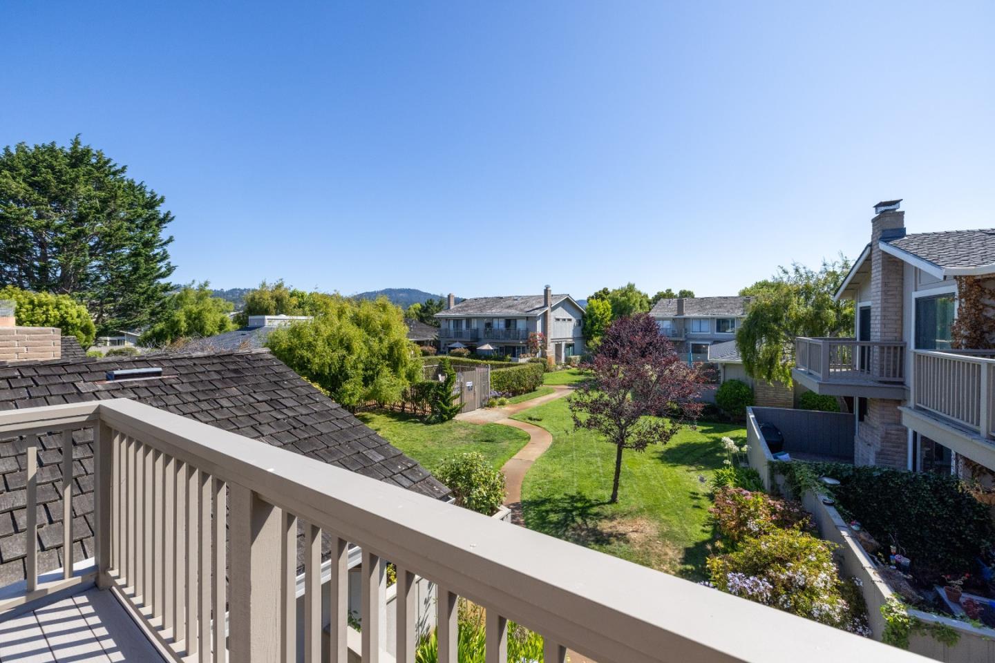 3850 Rio Road, Unit 61 Carmel, CA 93923 - Photo 15 of 46 a view of a garden from a balcony