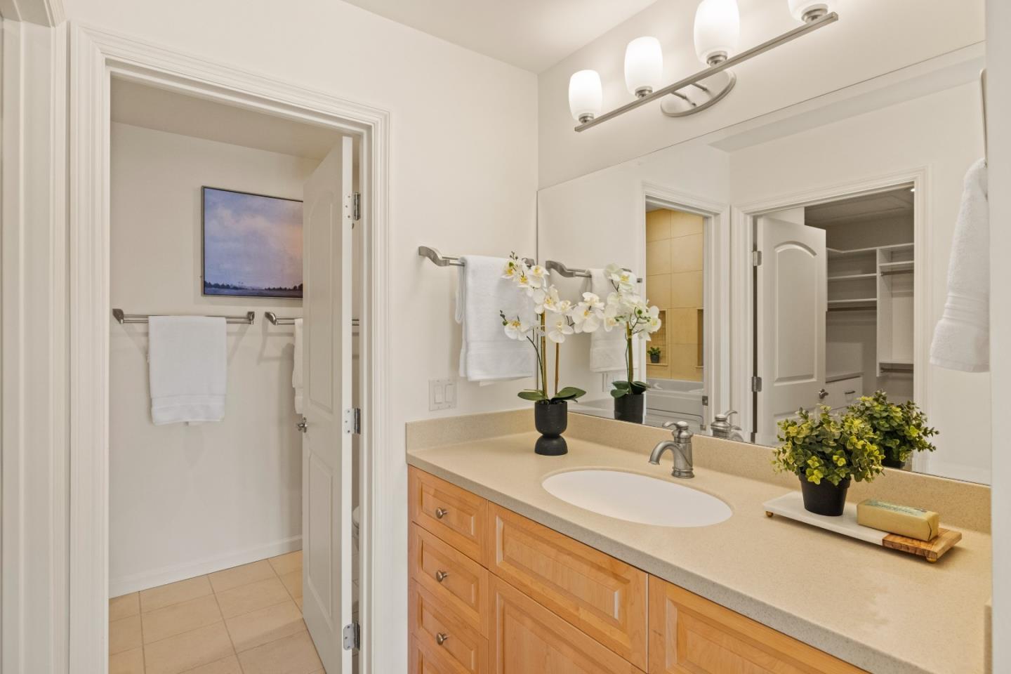 3850 Rio Road, Unit 61 Carmel, CA 93923 - Photo 20 of 46 a bathroom with a sink a vanity and a mirror