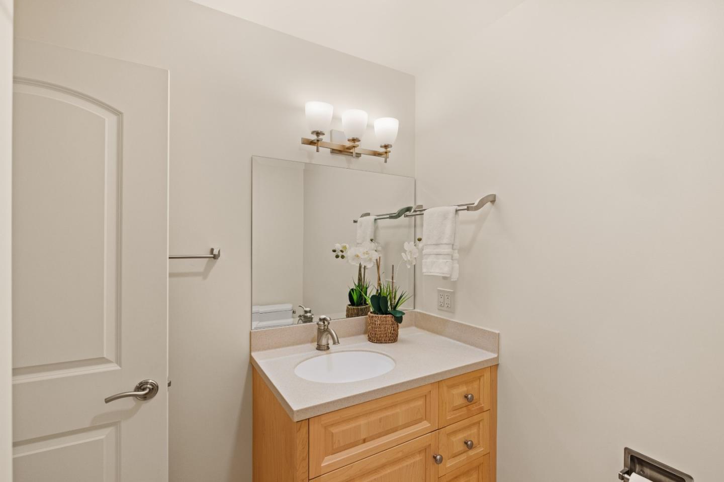 3850 Rio Road, Unit 61 Carmel, CA 93923 - Photo 27 of 46 a bathroom with a sink and a mirror
