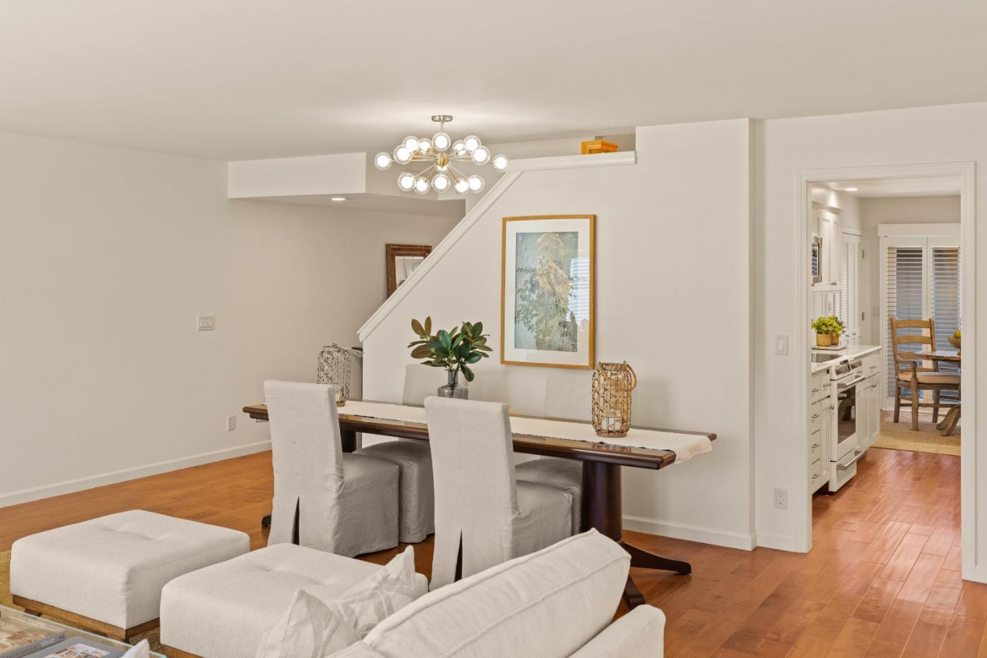 3850 Rio Road, Unit 61 Carmel, CA 93923 - Photo 4 of 46 a view of a dining room with furniture and wooden floor