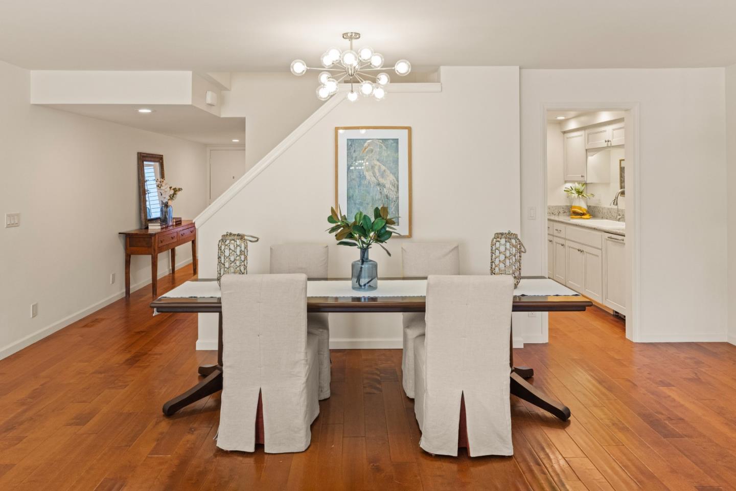 3850 Rio Road, Unit 61 Carmel, CA 93923 - Photo 5 of 46 a dining room with wooden floor and large windows