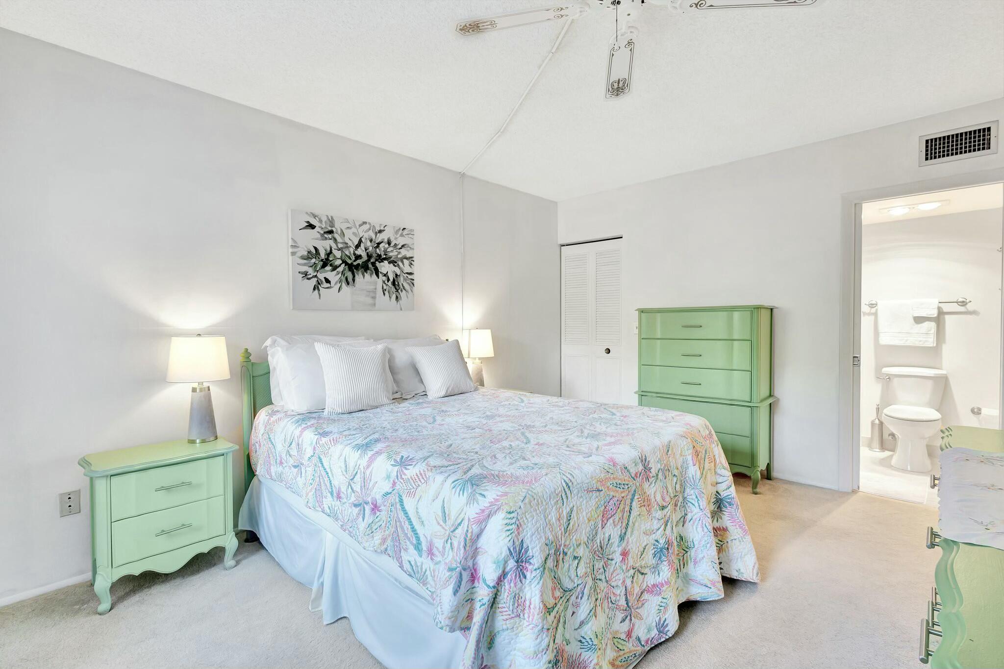 2320 Southwest 22nd Avenue, Unit 211 Delray Beach, FL 33445 - Photo 20 of 38 a bedroom with a large bed and a window