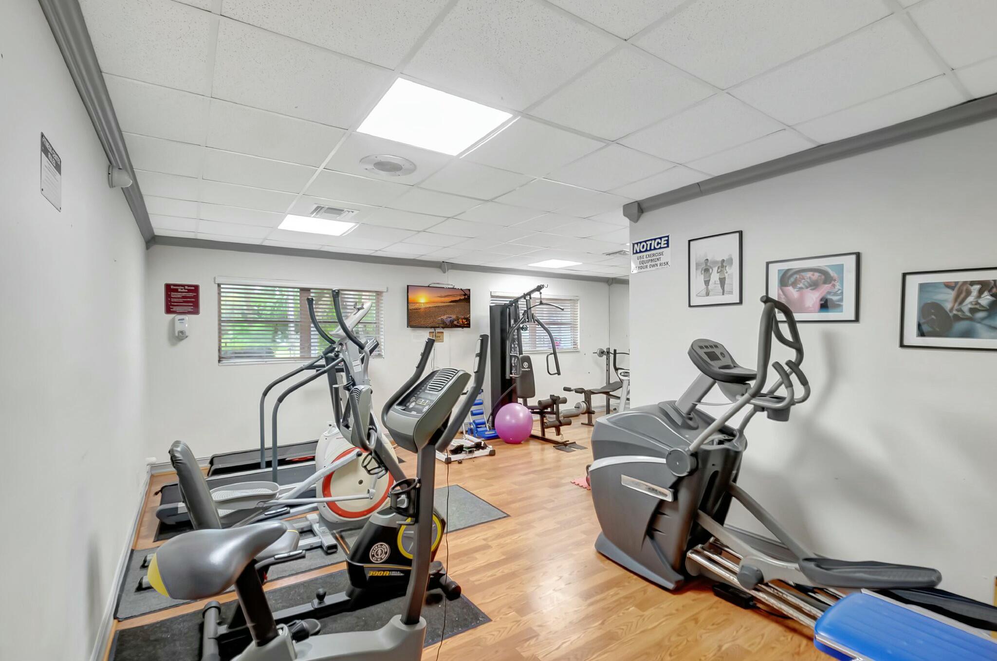 2320 Southwest 22nd Avenue, Unit 211 Delray Beach, FL 33445 - Photo 26 of 38 a view of a room with gym equipment