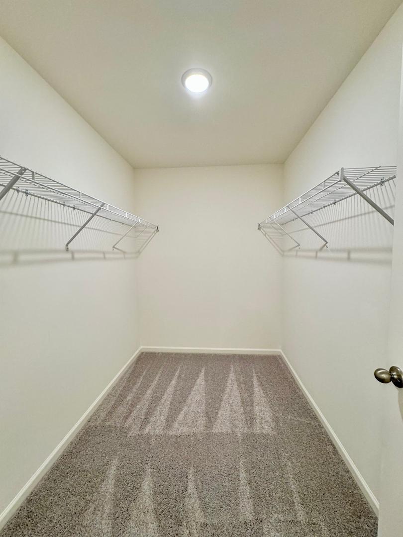 3117 Primo Drive Durham, NC 27704 - Photo 12 of 23 a view of a room with racks on the wall