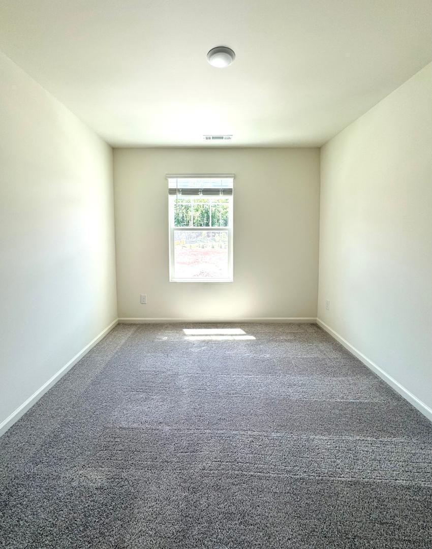 3117 Primo Drive Durham, NC 27704 - Photo 16 of 23 an empty room with a window