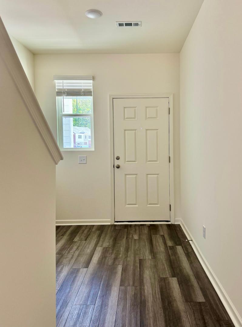 3117 Primo Drive Durham, NC 27704 - Photo 5 of 23 an empty room with wooden floor