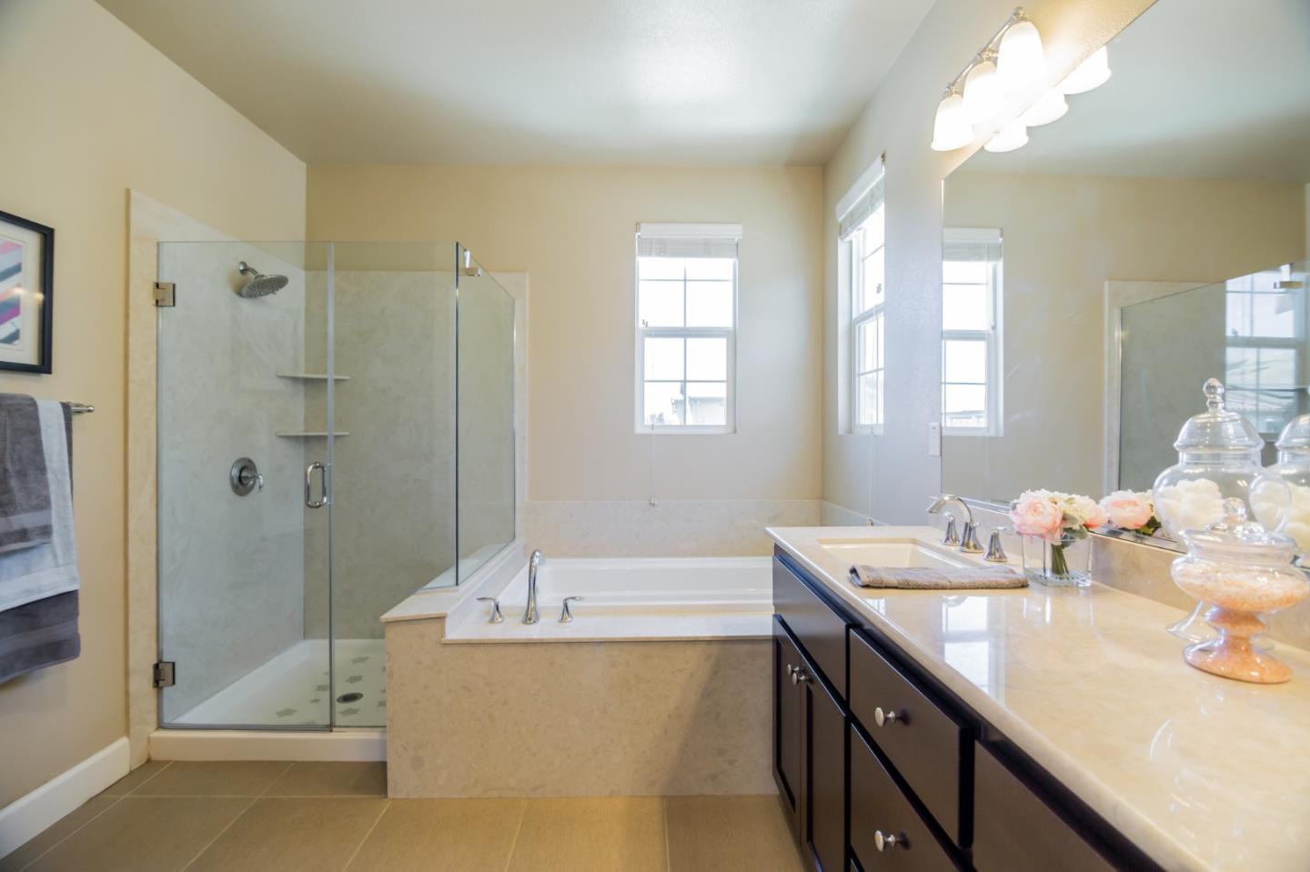 328 Gerald Circle Milpitas, CA 95035 - Photo 17 of 33 a bathroom with a tub sink shower and mirror