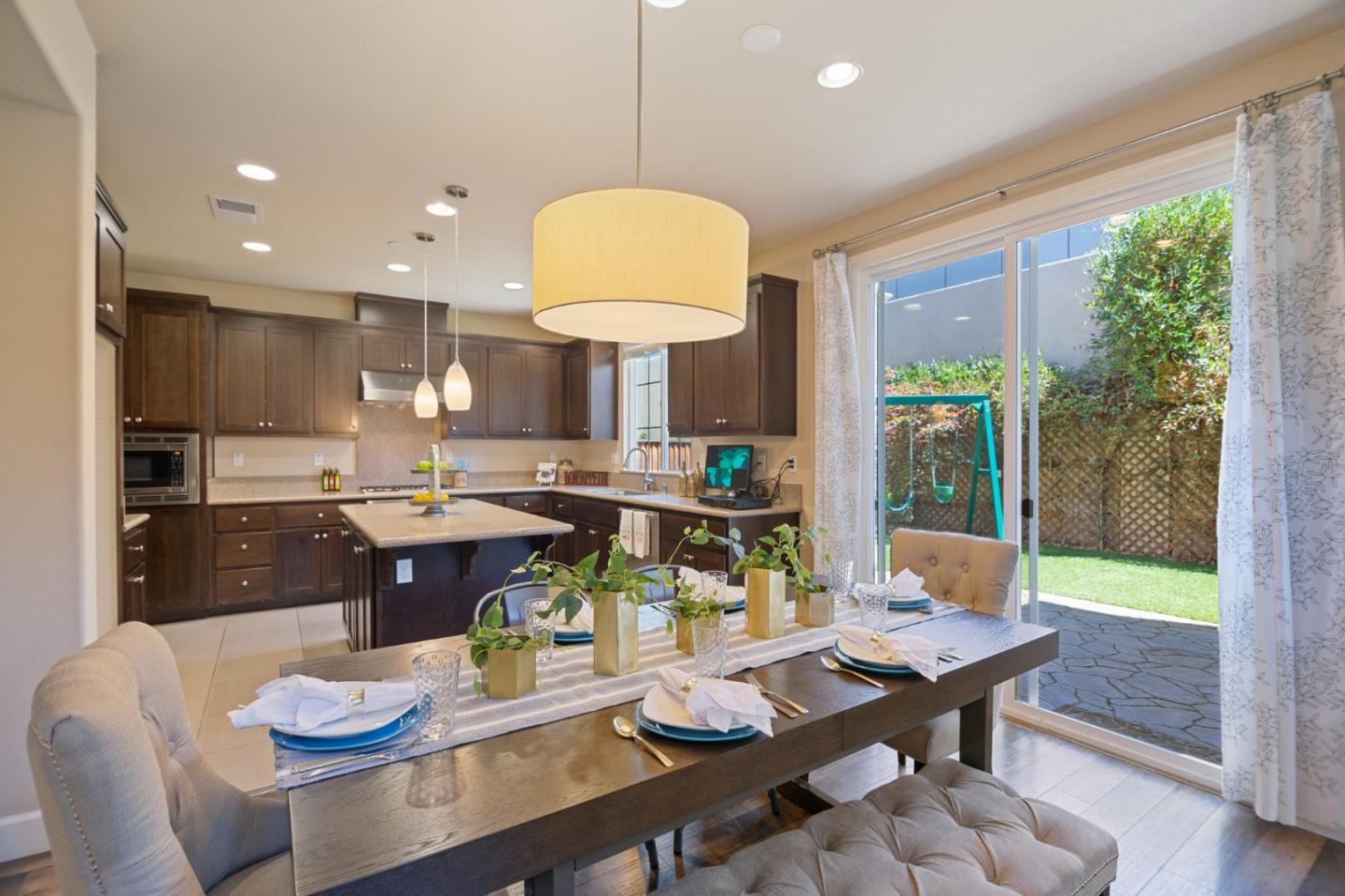 328 Gerald Circle Milpitas, CA 95035 - Photo 4 of 33 a living room with stainless steel appliances a table and chairs with kitchen view