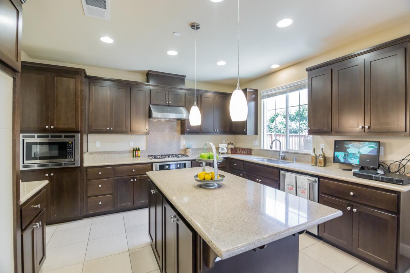 328 Gerald Circle Milpitas, CA 95035 - Photo 7 of 33 a kitchen with a sink a counter top space cabinets and stainless steel appliances