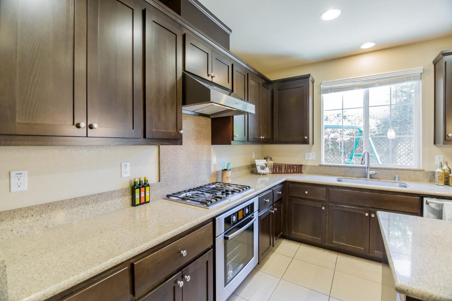 328 Gerald Circle Milpitas, CA 95035 - Photo 9 of 33 a kitchen with stainless steel appliances granite countertop a sink stove and cabinets