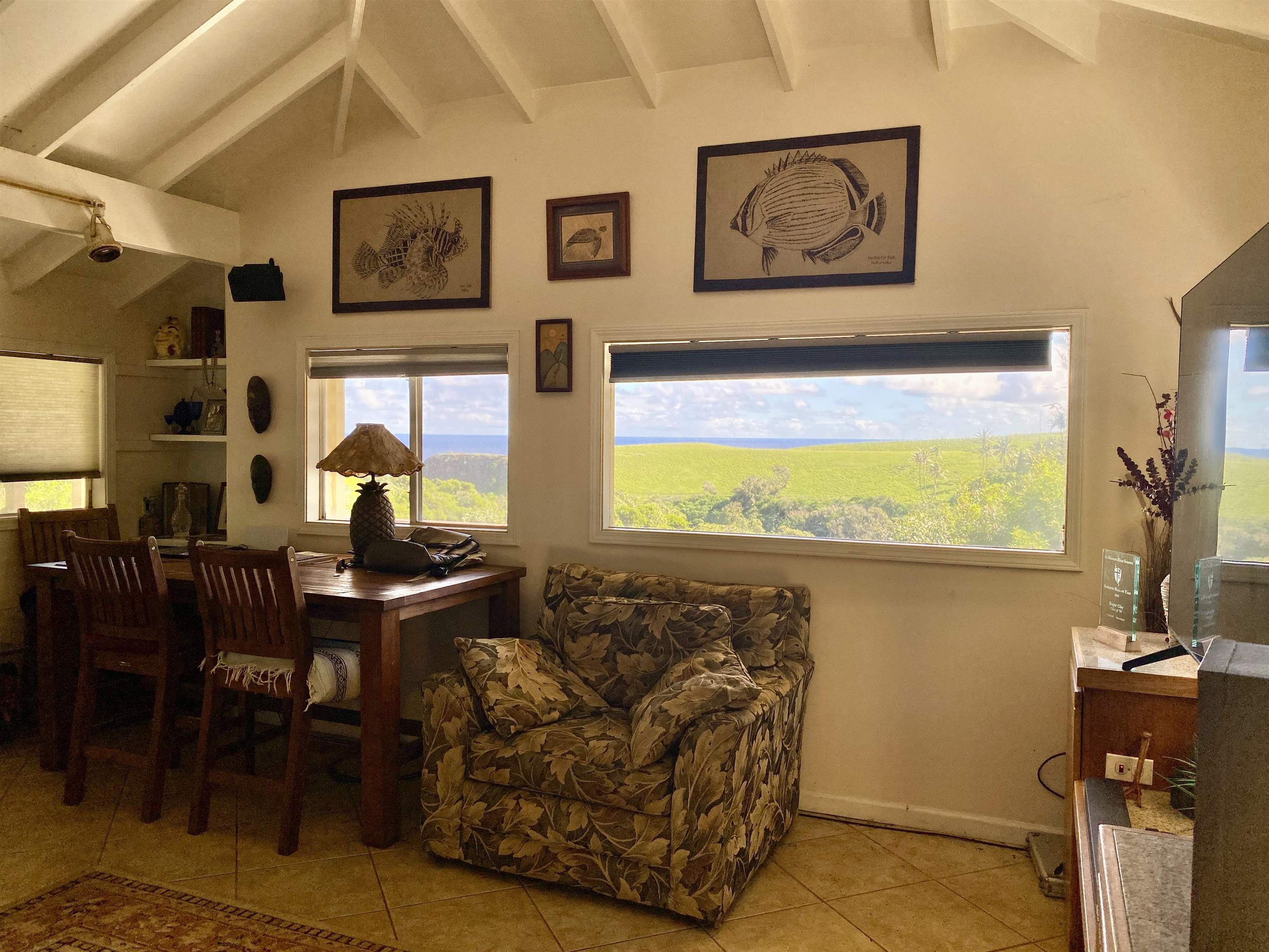 700 Honopou Road, Unit 700 HONOPOU RD Haiku, HI 96708 - Photo 16 of 50 a living room with furniture and a flat screen tv