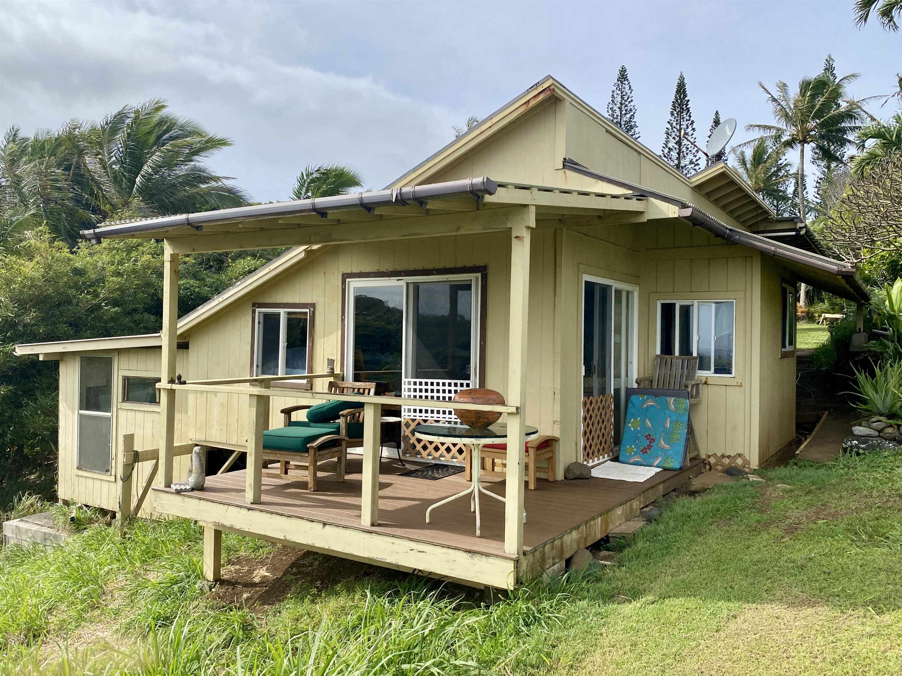 700 Honopou Road, Unit 700 HONOPOU RD Haiku, HI 96708 - Photo 27 of 50 a view of a house with a yard and potted plants