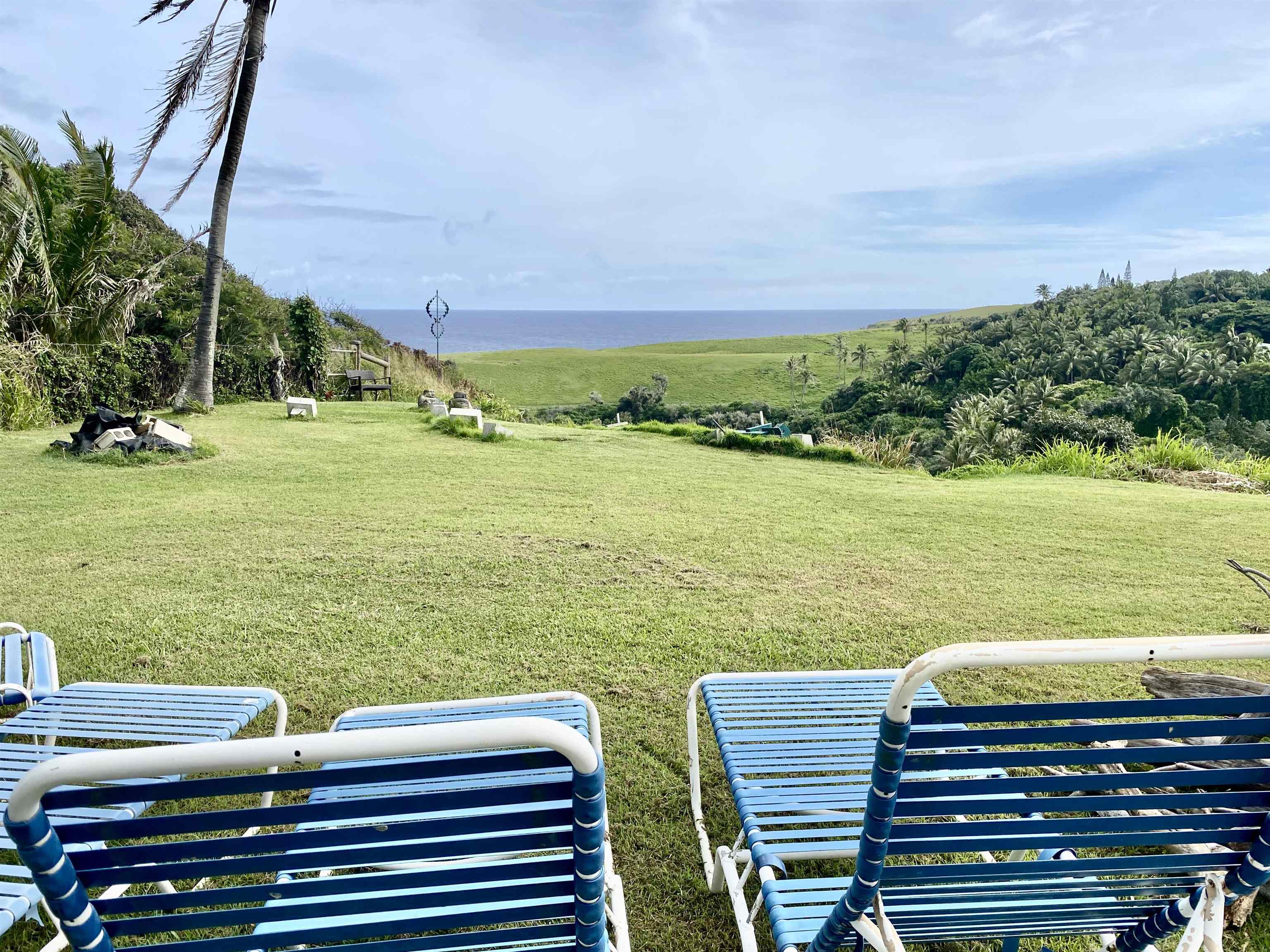 700 Honopou Road, Unit 700 HONOPOU RD Haiku, HI 96708 - Photo 31 of 50 a view of a lake with a yard