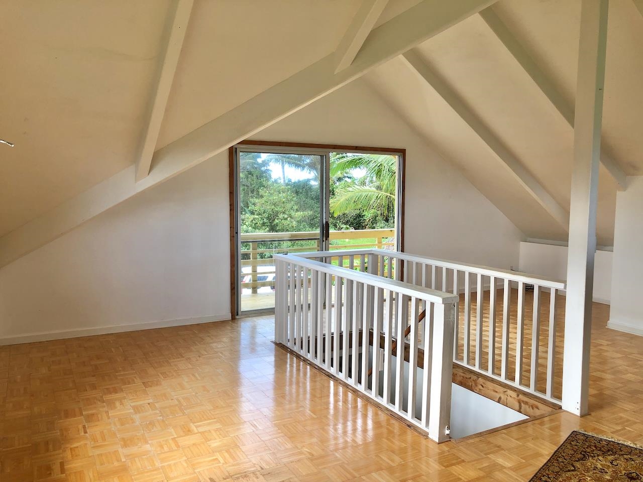 700 Honopou Road, Unit 700 HONOPOU RD Haiku, HI 96708 - Photo 9 of 50 a view of a room with wooden floor and a window
