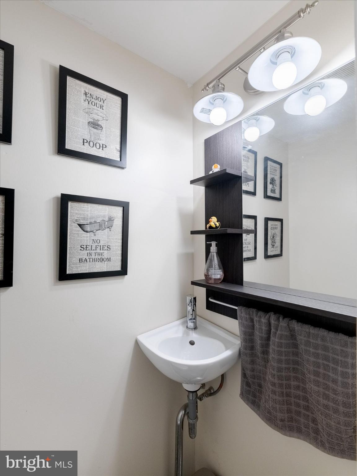 908 West Amosland Road Prospect Park, PA 19076 - Photo 12 of 35 a bathroom with a sink and a mirror