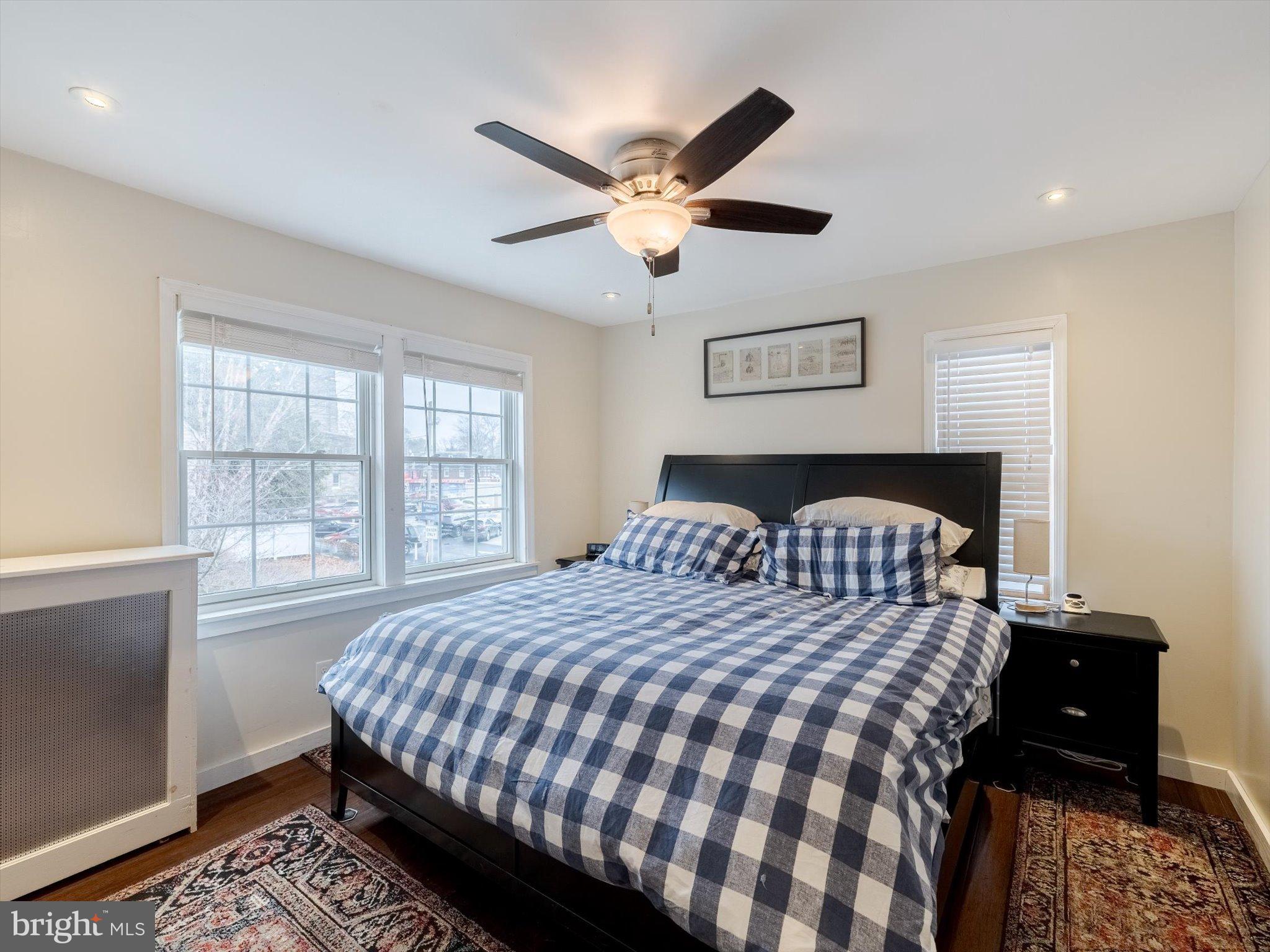 908 West Amosland Road Prospect Park, PA 19076 - Photo 18 of 35 a bedroom with a bed and a table with lamp