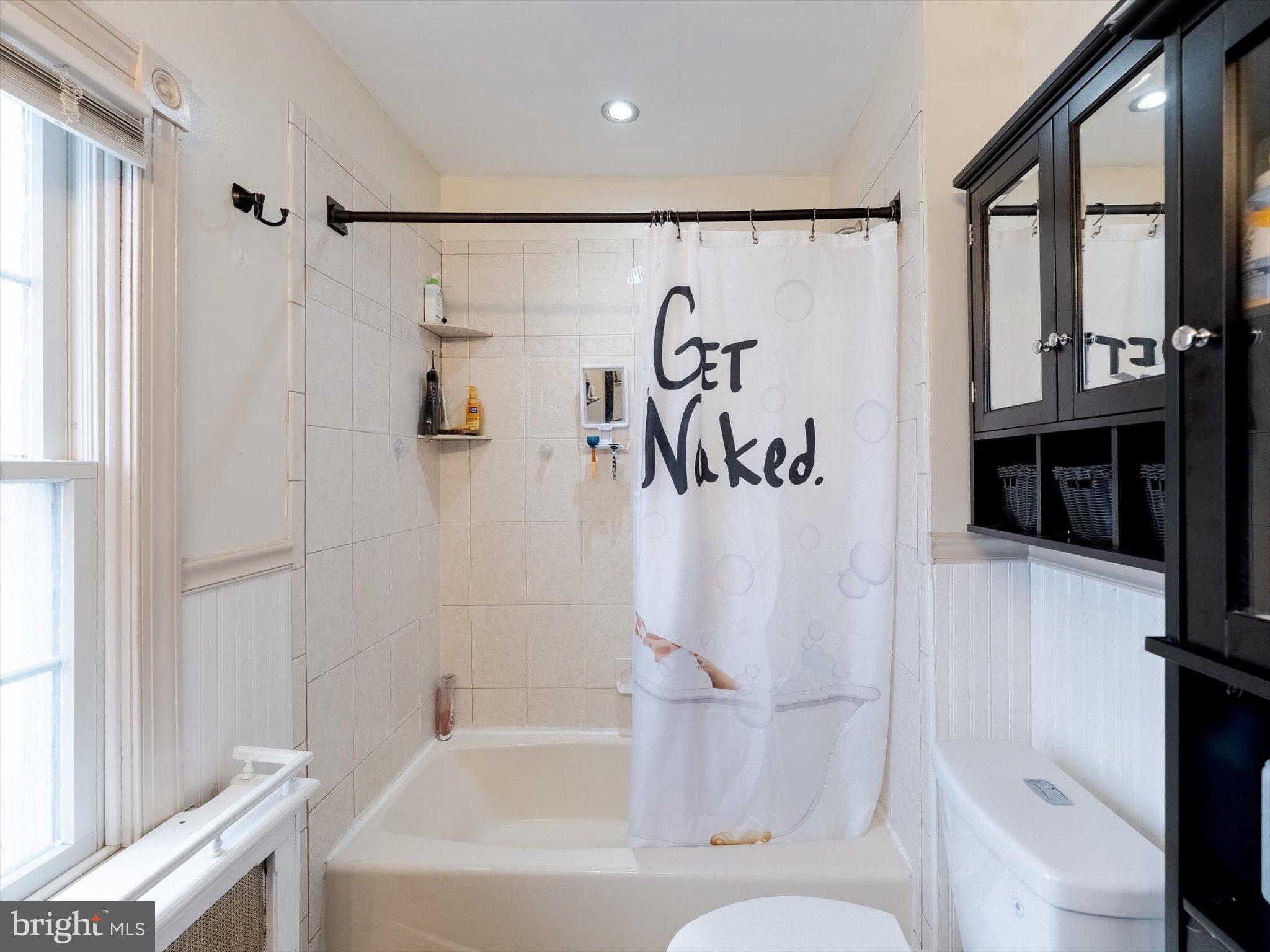 908 West Amosland Road Prospect Park, PA 19076 - Photo 22 of 35 a bathroom with a bathtub and a shower