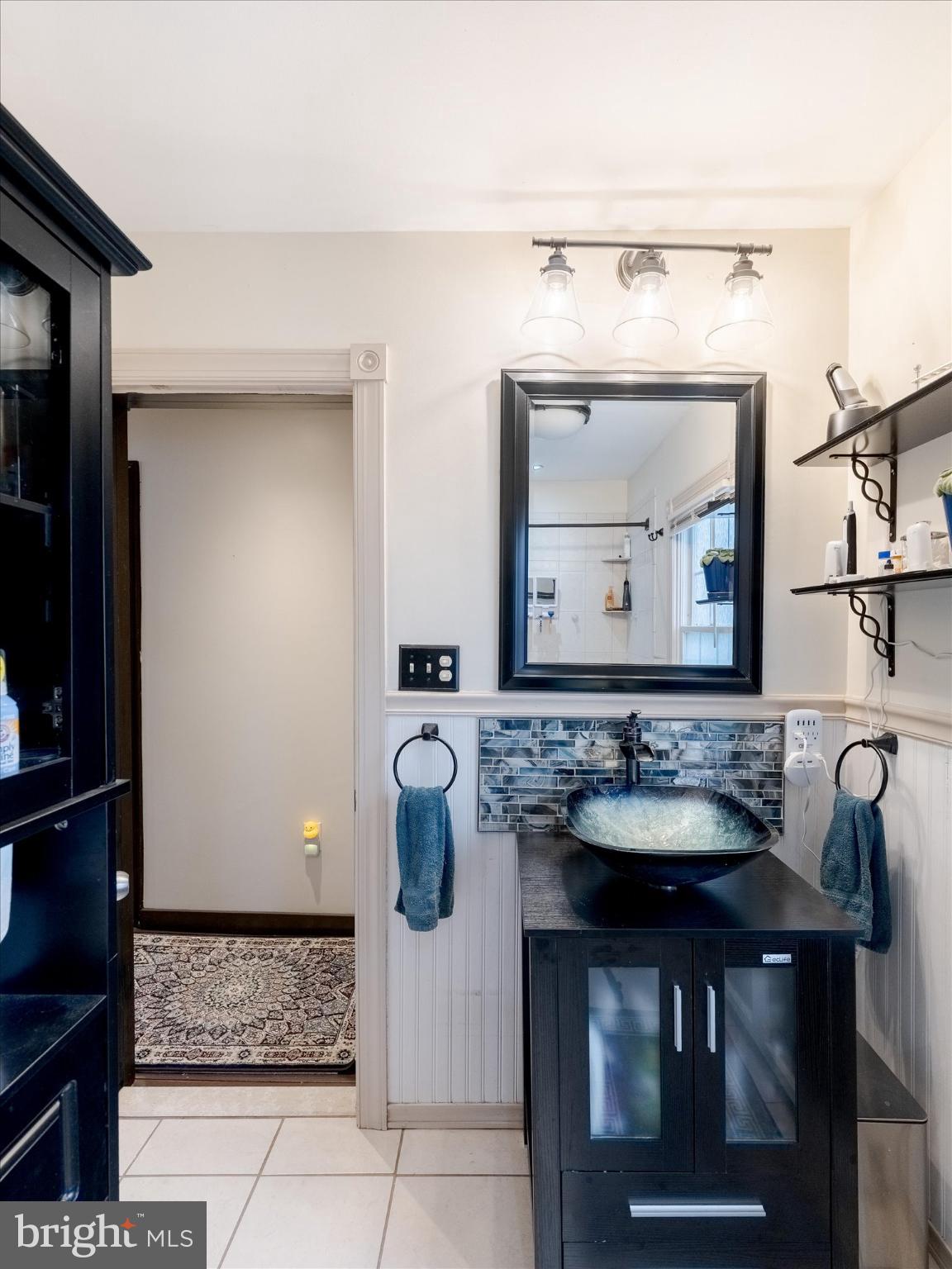 908 West Amosland Road Prospect Park, PA 19076 - Photo 24 of 35 a bathroom with a sink and a mirror