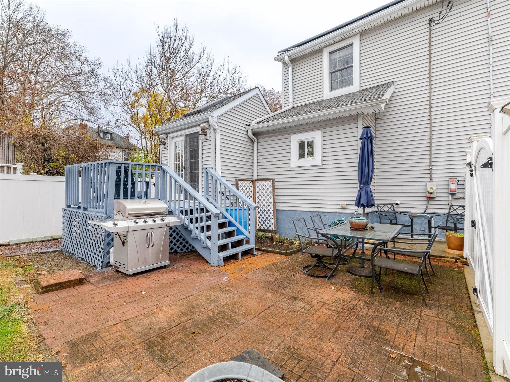 908 West Amosland Road Prospect Park, PA 19076 - Photo 31 of 35 a view of a patio with a dining table and chairs