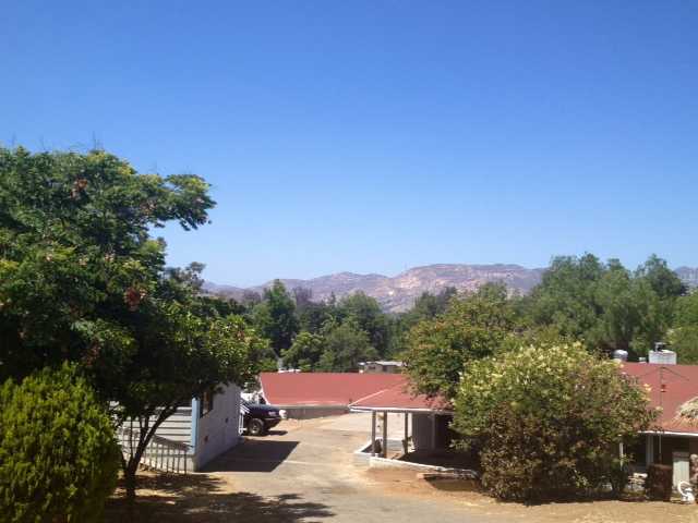 12236 Rockcrest Road Lakeside, CA 92040 - Photo 1 of 8 Entry to main house and granny flat. Circular driveway allows access throughout the property.