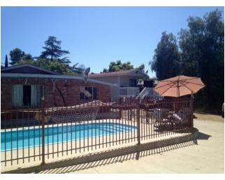 12236 Rockcrest Road Lakeside, CA 92040 - Photo 2 of 8 Rear view of main house, refreshing pool and granny flat.