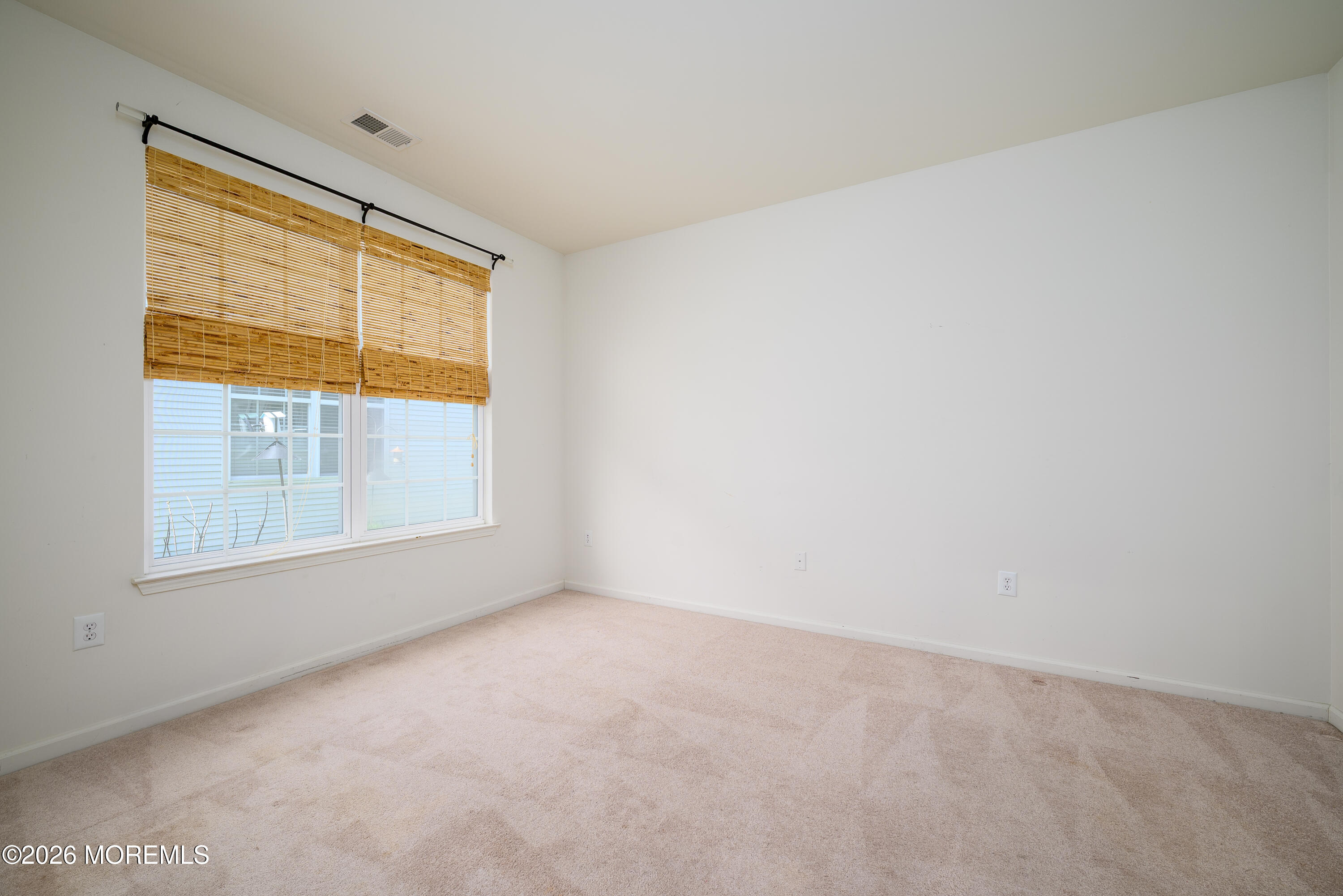 33 Cromwell Lane Jackson, NJ 08527 - Photo 19 of 32 a view of an empty room with a window