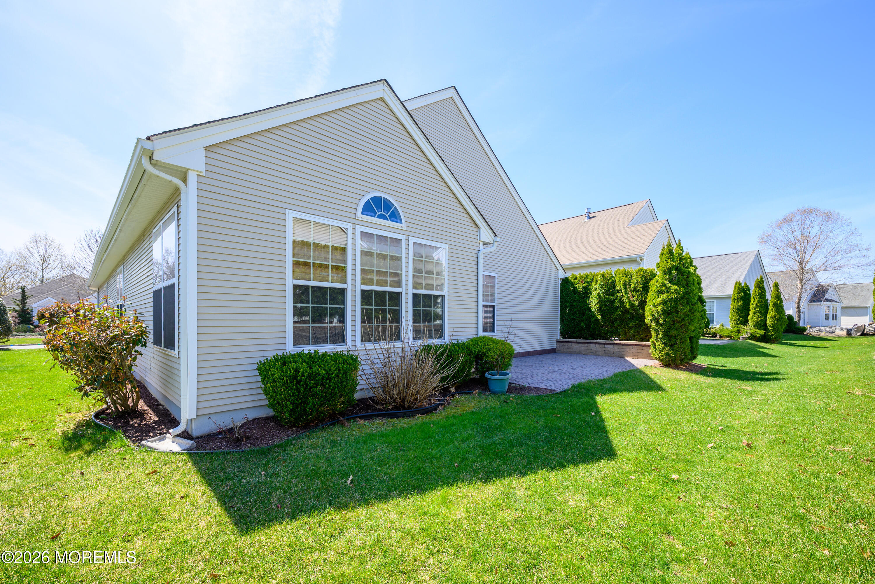 33 Cromwell Lane Jackson, NJ 08527 - Photo 28 of 32 a view of a house with a yard and plants