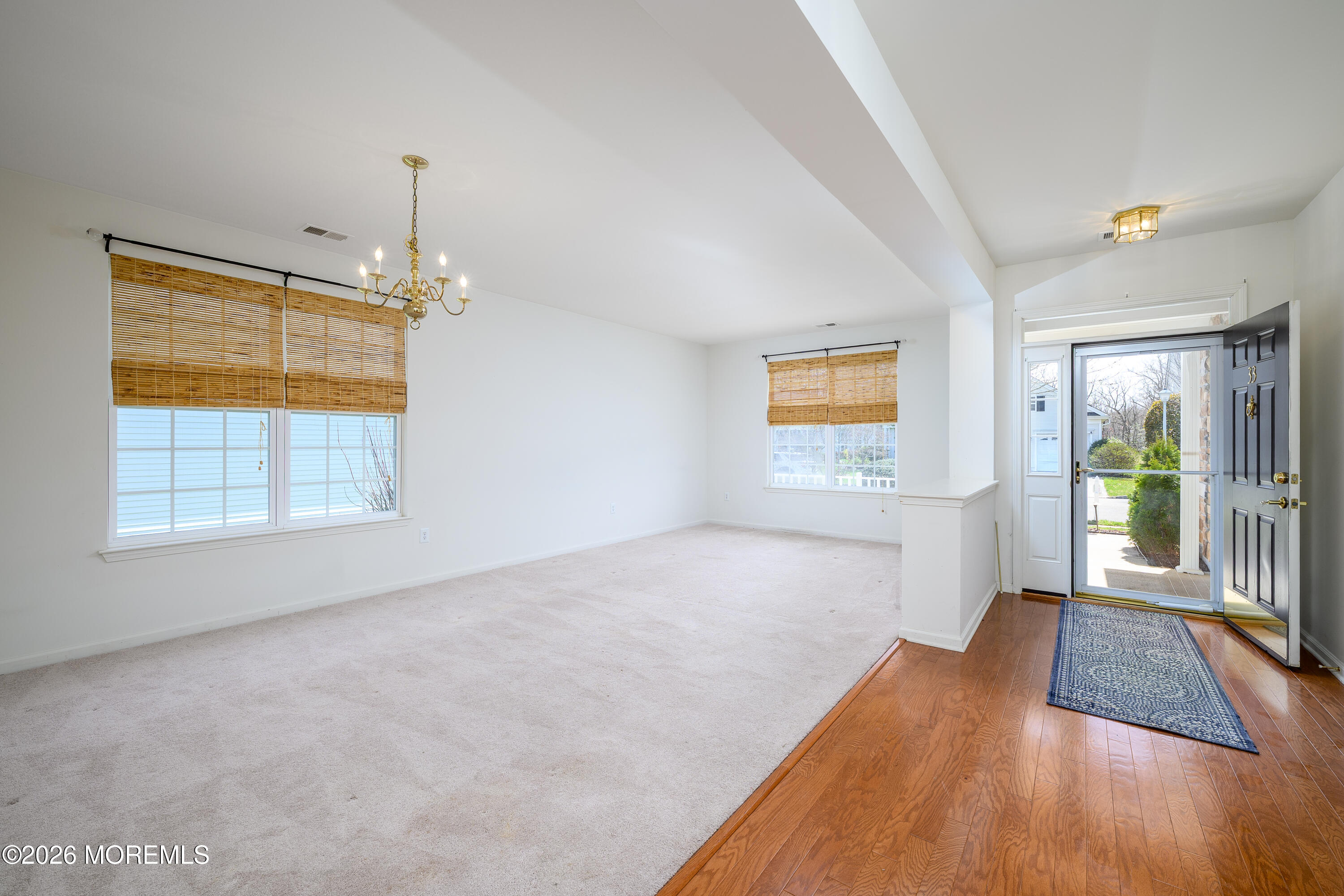33 Cromwell Lane Jackson, NJ 08527 - Photo 4 of 32 a view of empty room with wooden floor and fan