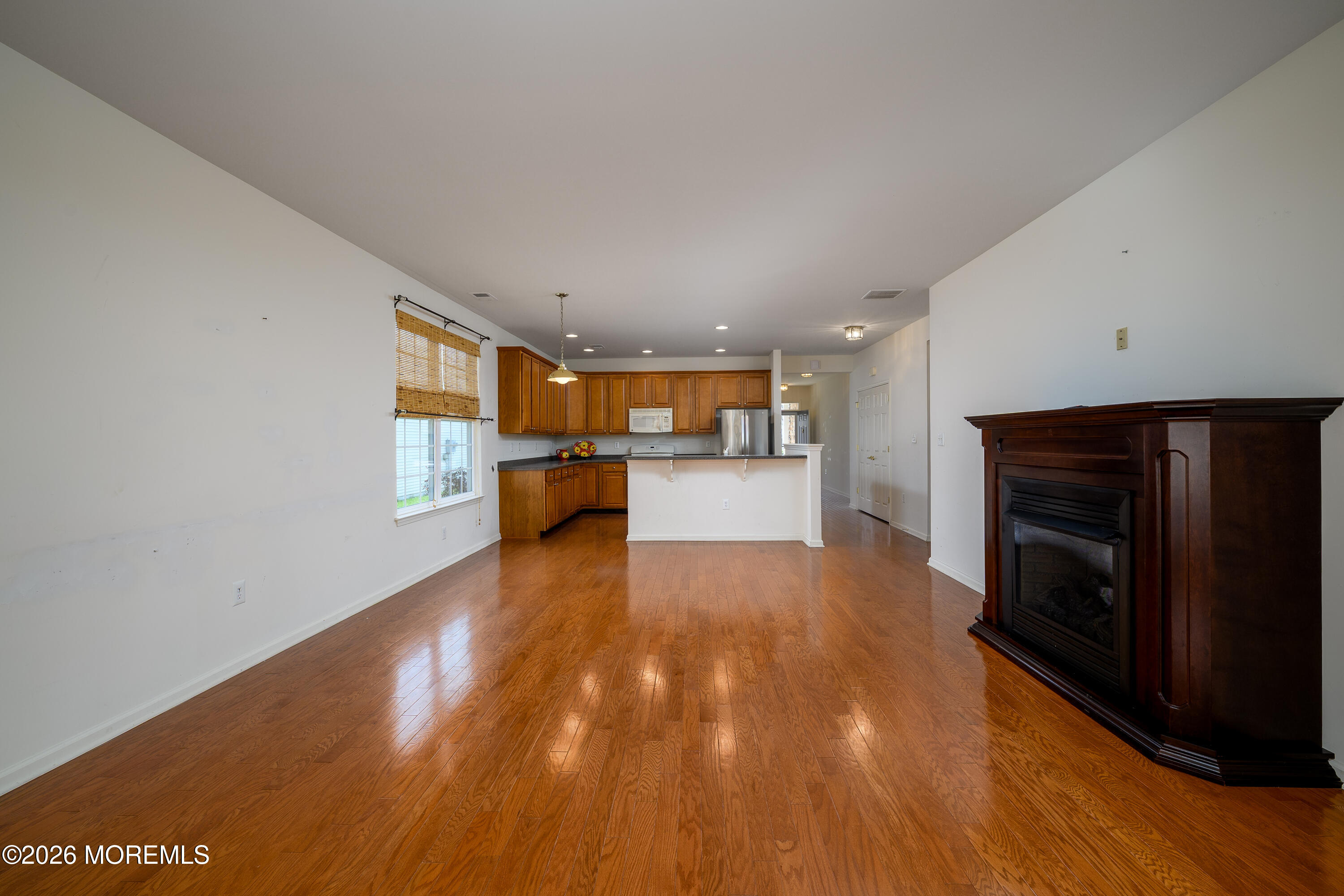 33 Cromwell Lane Jackson, NJ 08527 - Photo 7 of 32 a view of kitchen with furniture and wooden floor