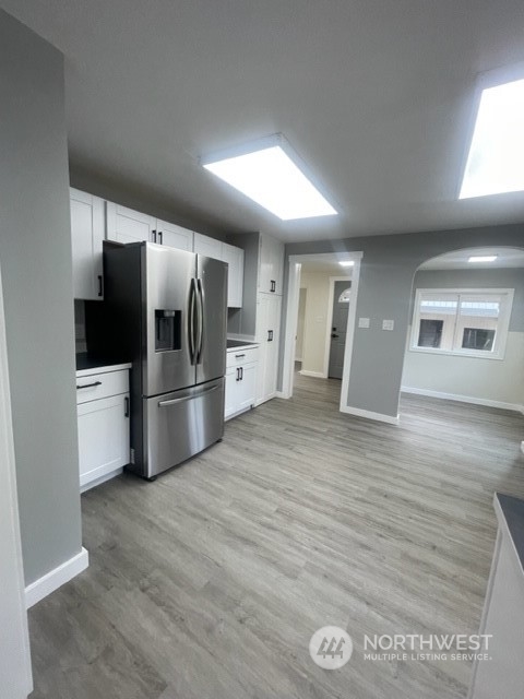 1244 Cedar Street Raymond, WA 98577 - Photo 12 of 25 a kitchen with stainless steel appliances a refrigerator and a stove