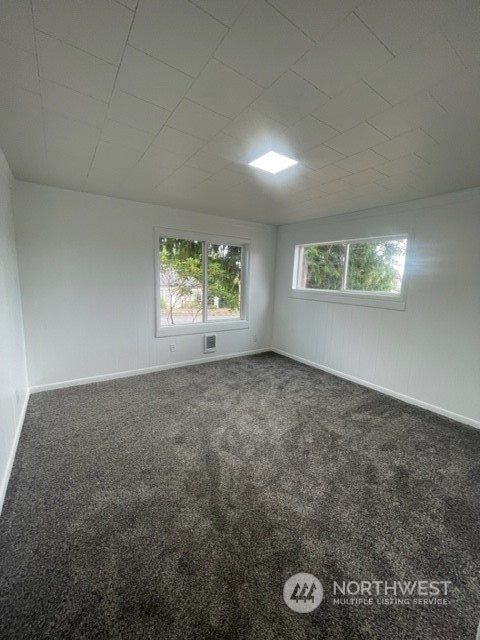 1244 Cedar Street Raymond, WA 98577 - Photo 15 of 25 an empty room with windows