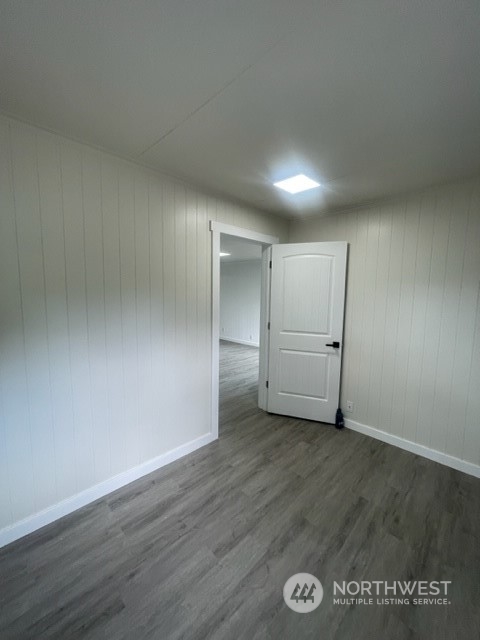 1244 Cedar Street Raymond, WA 98577 - Photo 5 of 25 a view of an empty room and wooden floor