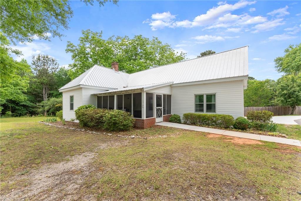 1519 New Hope Church Road Loganville, GA 30052 - Photo 1 of 48 a view of a house with a yard
