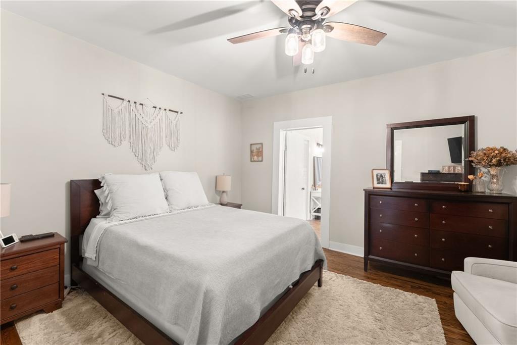 1519 New Hope Church Road Loganville, GA 30052 - Photo 15 of 48 a bedroom with a bed and a chandelier