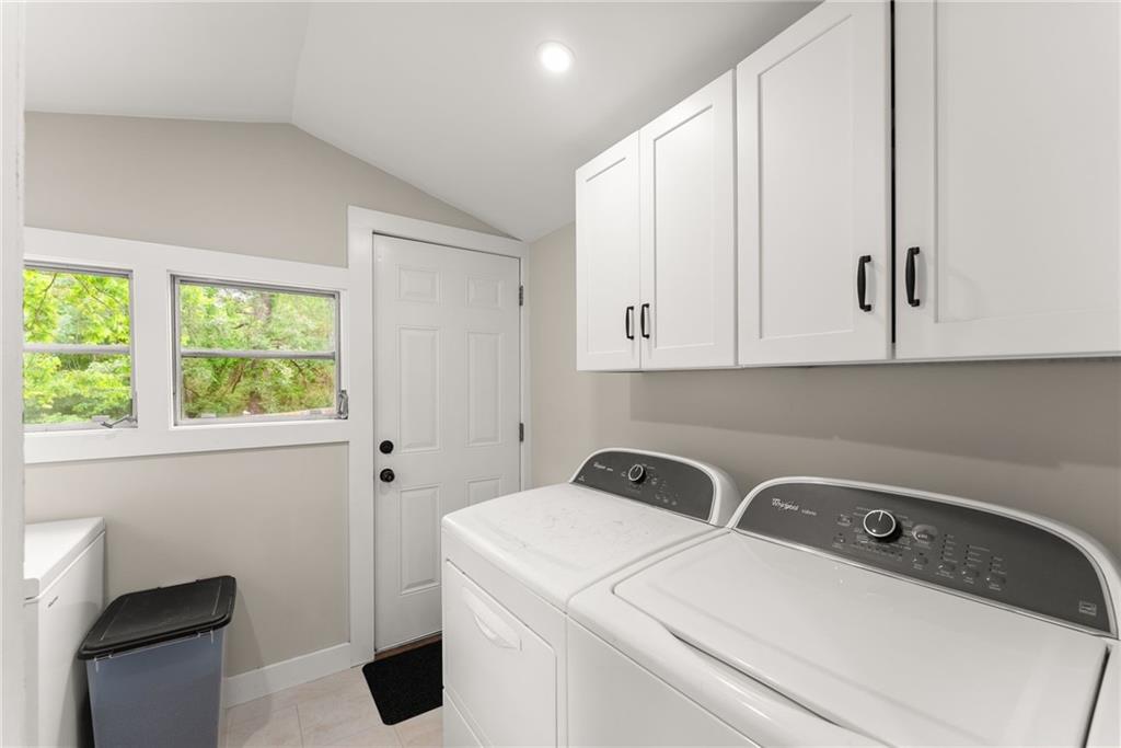 1519 New Hope Church Road Loganville, GA 30052 - Photo 29 of 48 a view of storage and utility room with washer and dryer