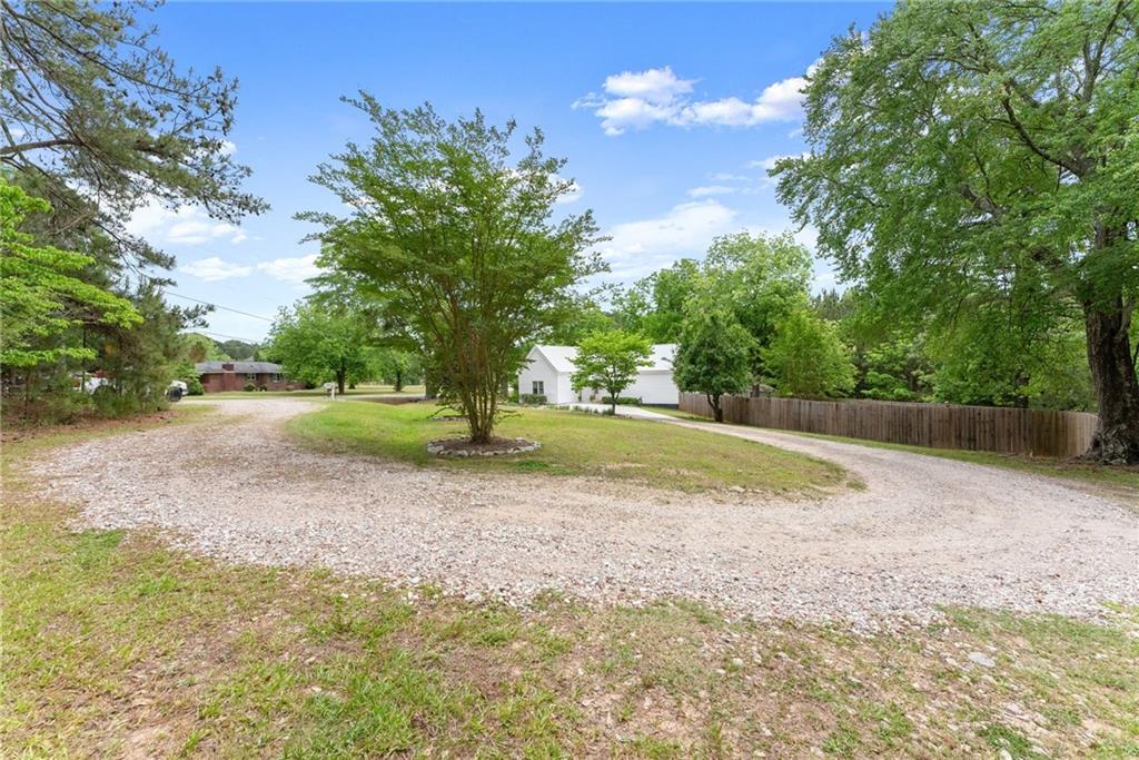 1519 New Hope Church Road Loganville, GA 30052 - Photo 3 of 48 a view of a yard with tiny trees