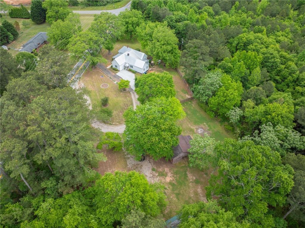 1519 New Hope Church Road Loganville, GA 30052 - Photo 47 of 48 an aerial view of a residential houses with outdoor space and trees all around