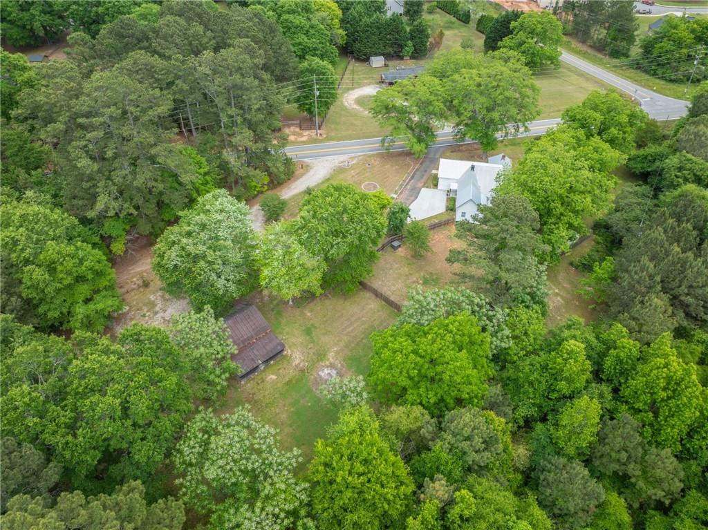 1519 New Hope Church Road Loganville, GA 30052 - Photo 48 of 48 an aerial view of residential house with outdoor space and trees all around