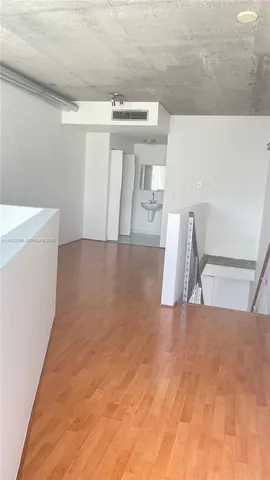 a view of a hallway with staircase