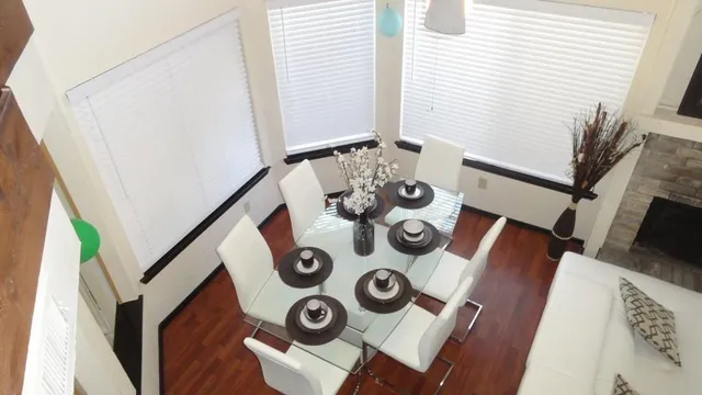 a dining room with furniture and a flat screen tv