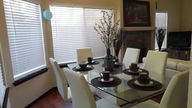 a kitchen with stainless steel appliances granite countertop a refrigerator sink and stove