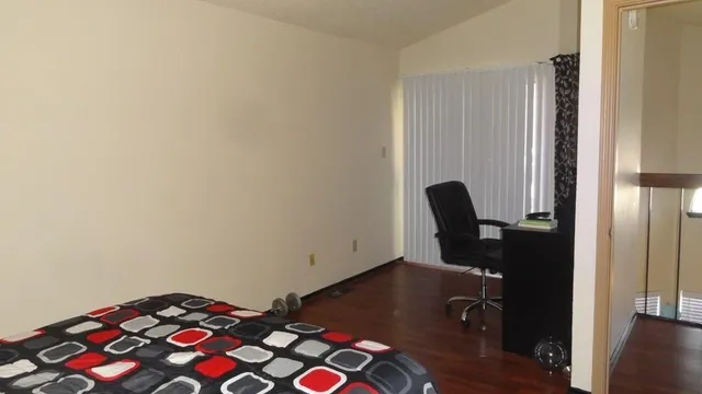 a view of entryway with workspace and windows