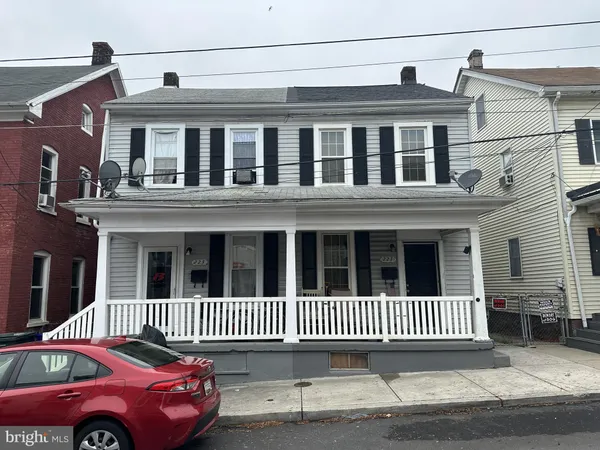 a front view of a house with a deck