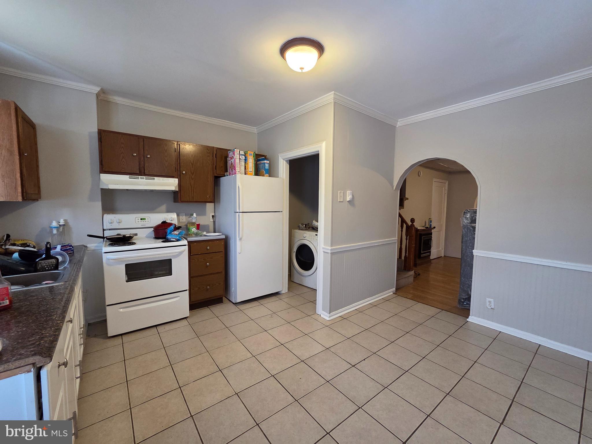 223 Summer Street Hagerstown, MD 21740 - Photo 12 of 15 a kitchen with a refrigerator sink and cabinets