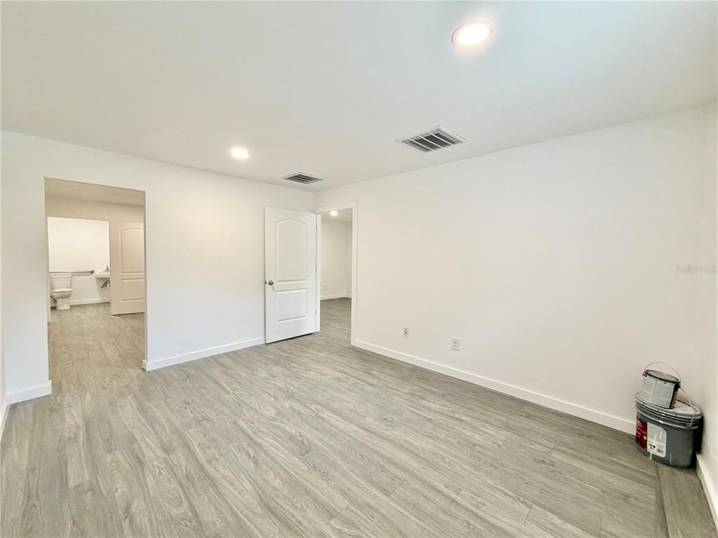 683 North Court Street Bronson, FL 32621 - Photo 11 of 33 a view of an empty room and wooden floor