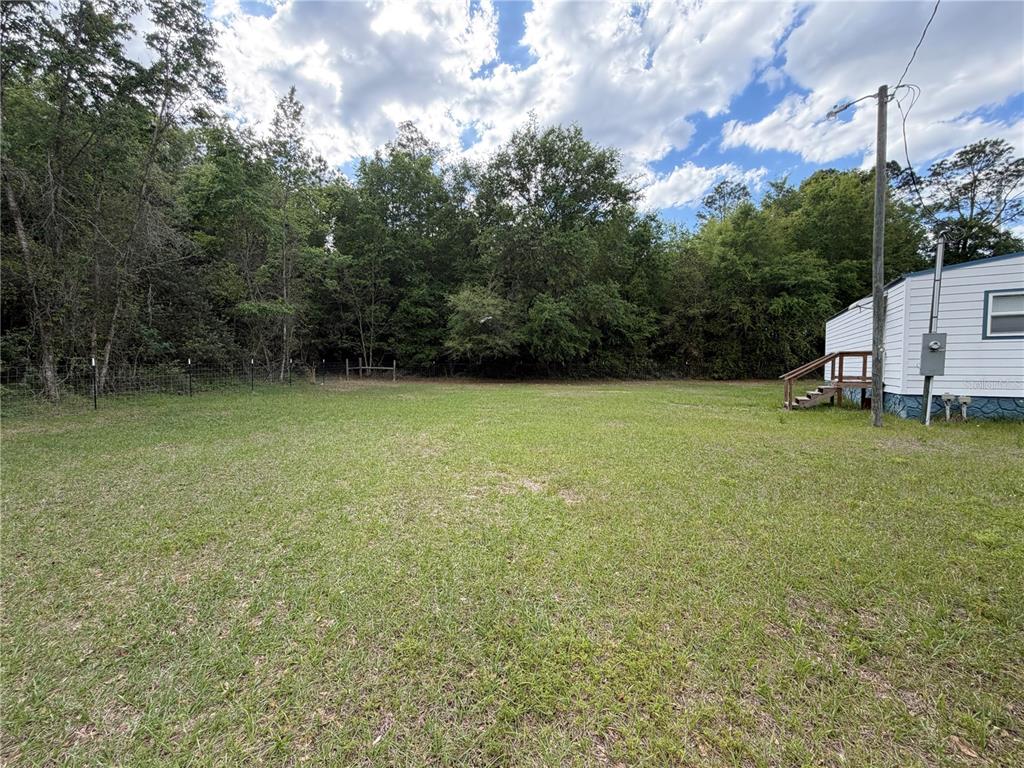 683 North Court Street Bronson, FL 32621 - Photo 16 of 33 a view of a backyard