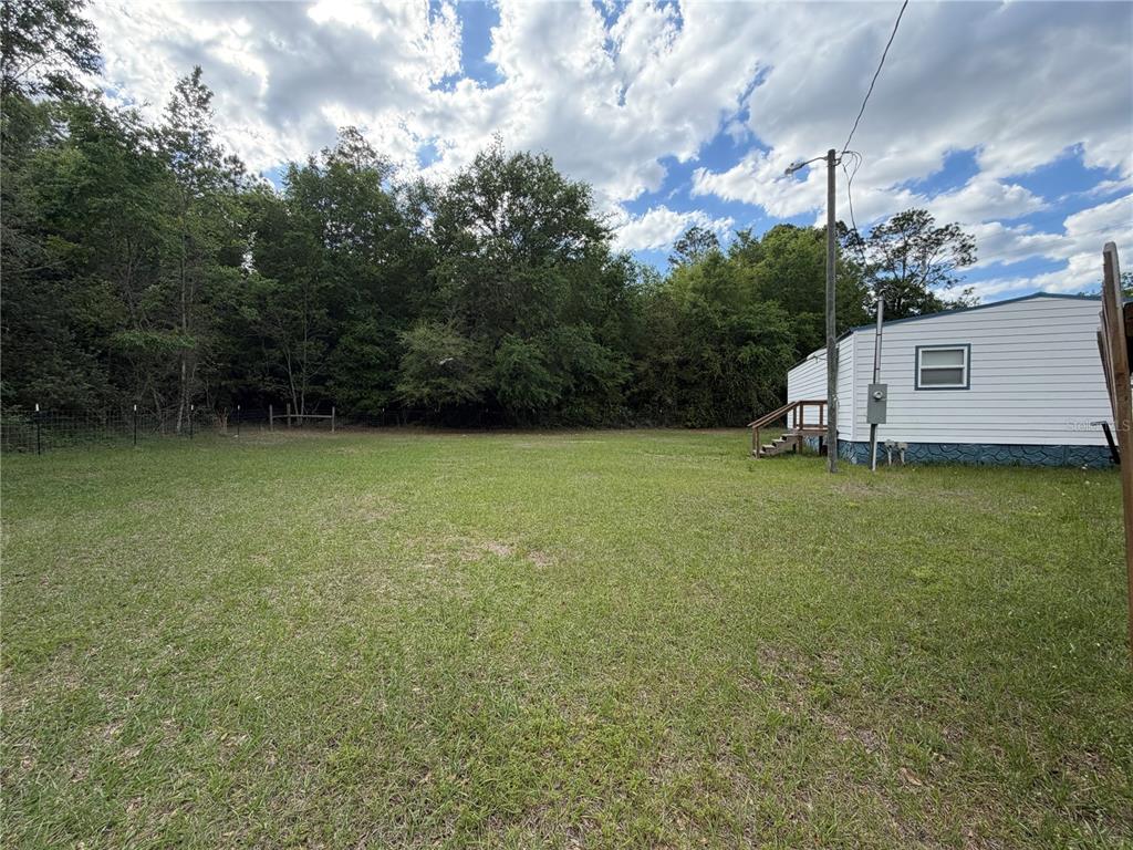 683 North Court Street Bronson, FL 32621 - Photo 17 of 33 a view of a backyard