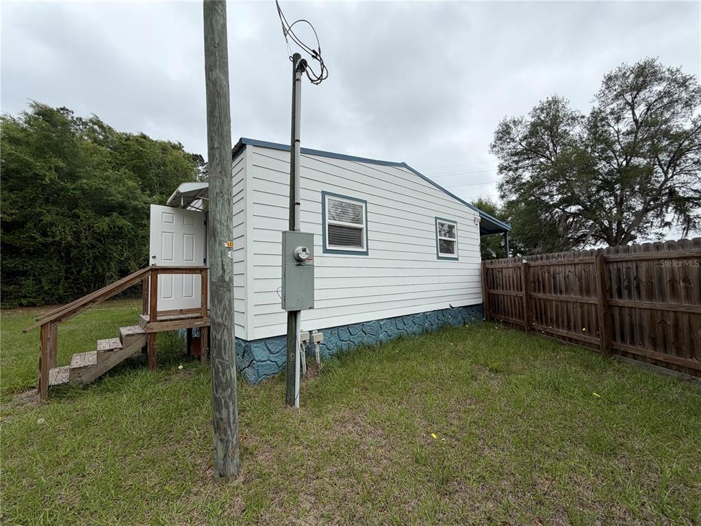 683 North Court Street Bronson, FL 32621 - Photo 24 of 33 a view of a backyard with a fence